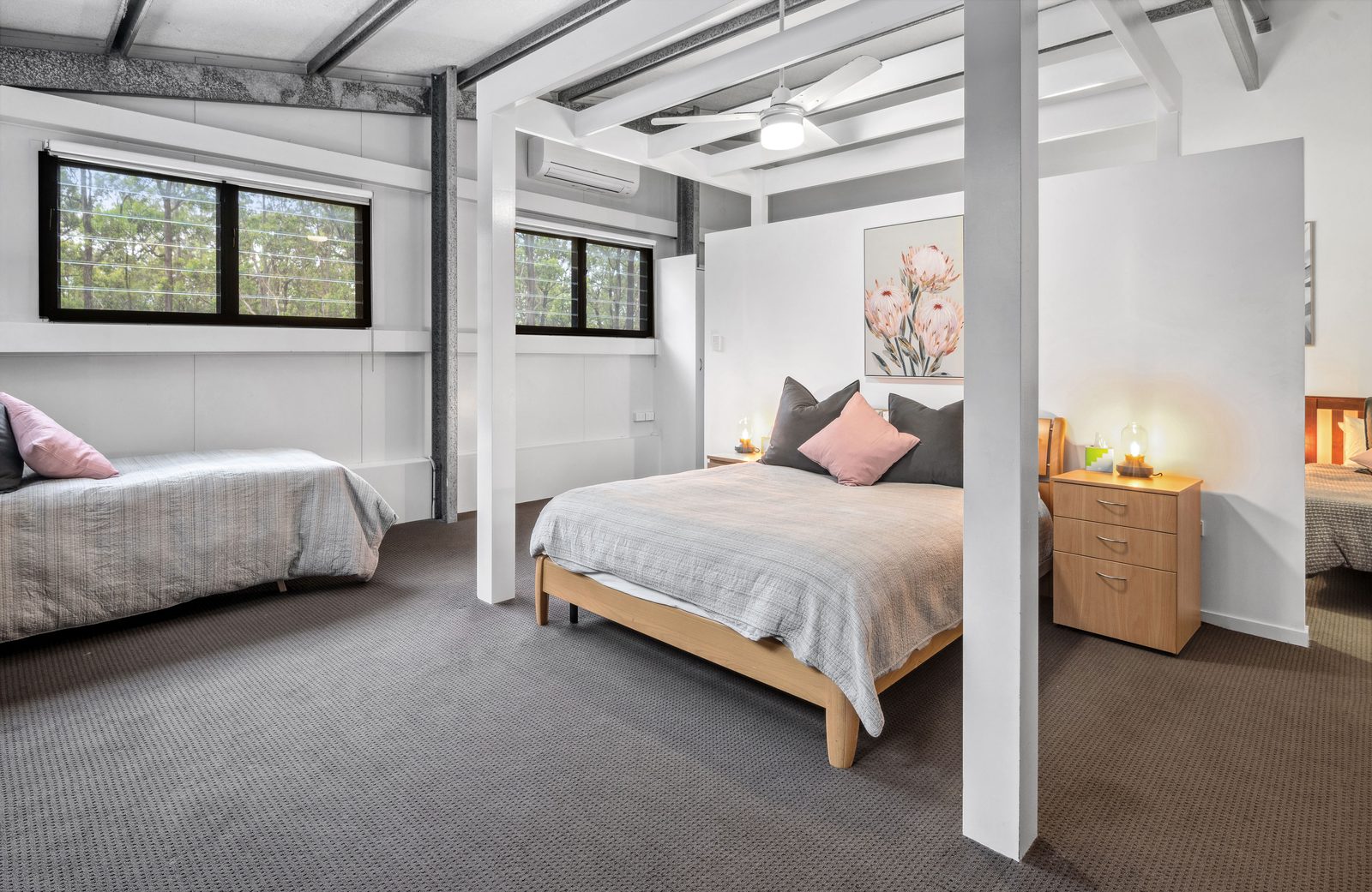 Spacious upstairs bedroom with multiple beds