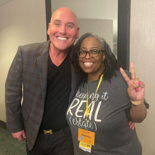 Real estate agents posing with 'keeping it REAL (estate)' shirt