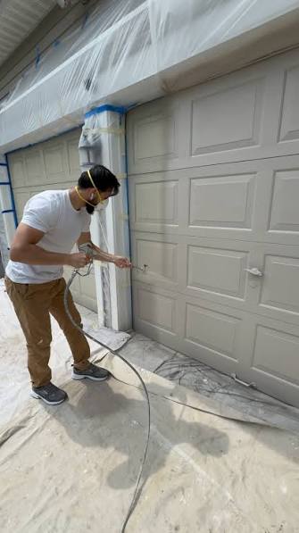 Exterior garage door painting in Calgary