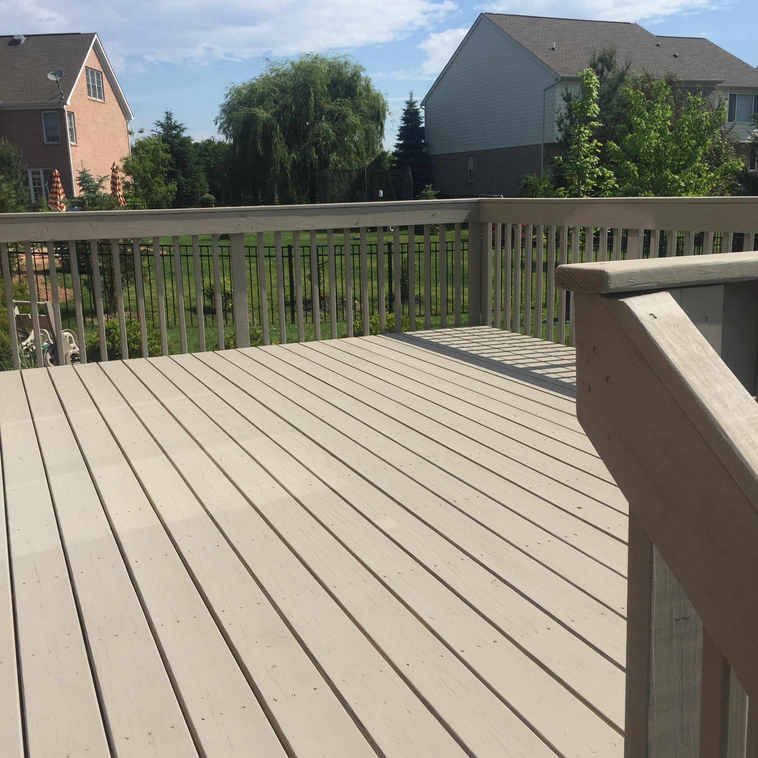 Professional deck painting services in Calgary by Crown Apex Corp