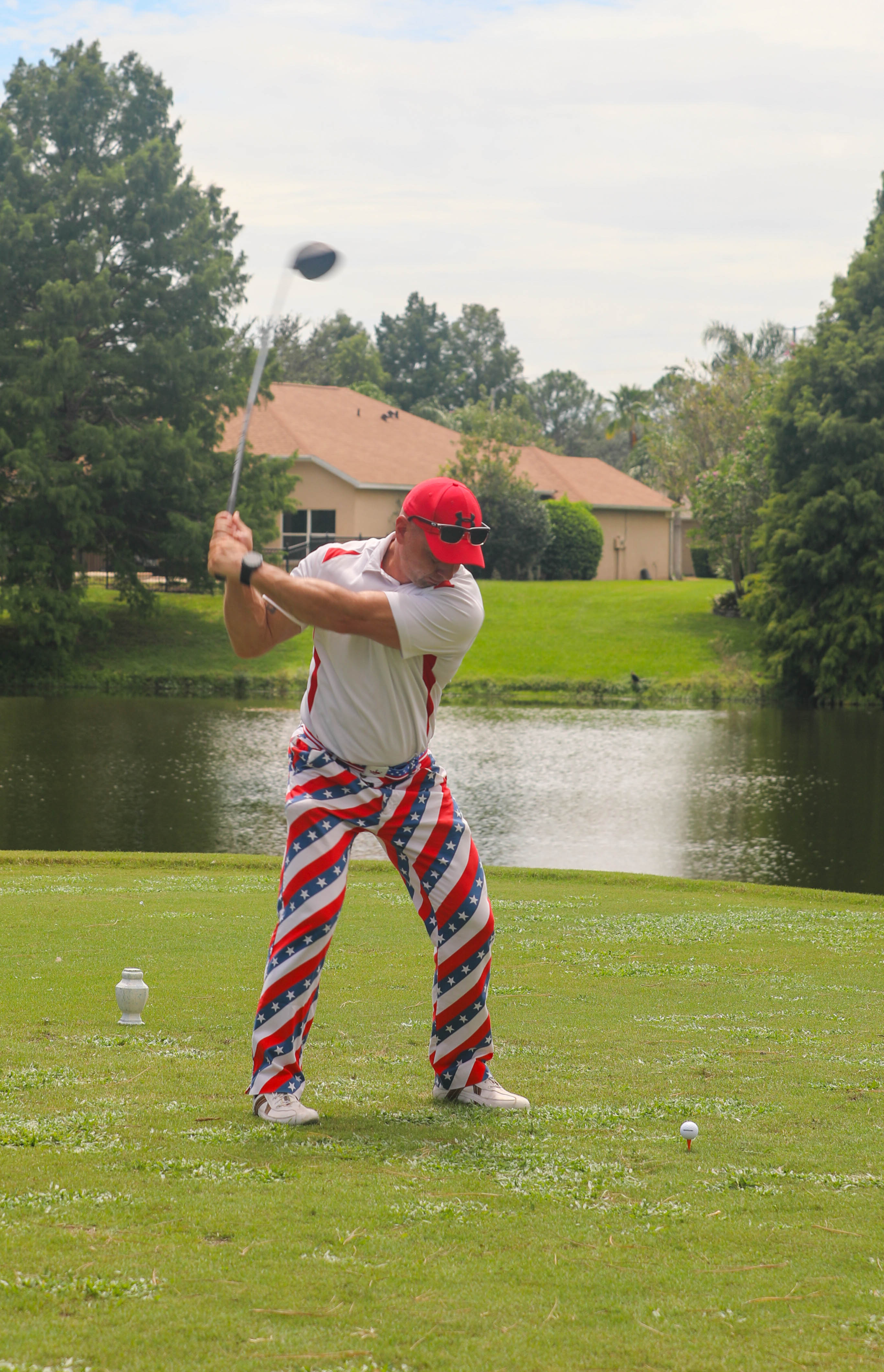 Golfer taking a swing during the memorial tournament