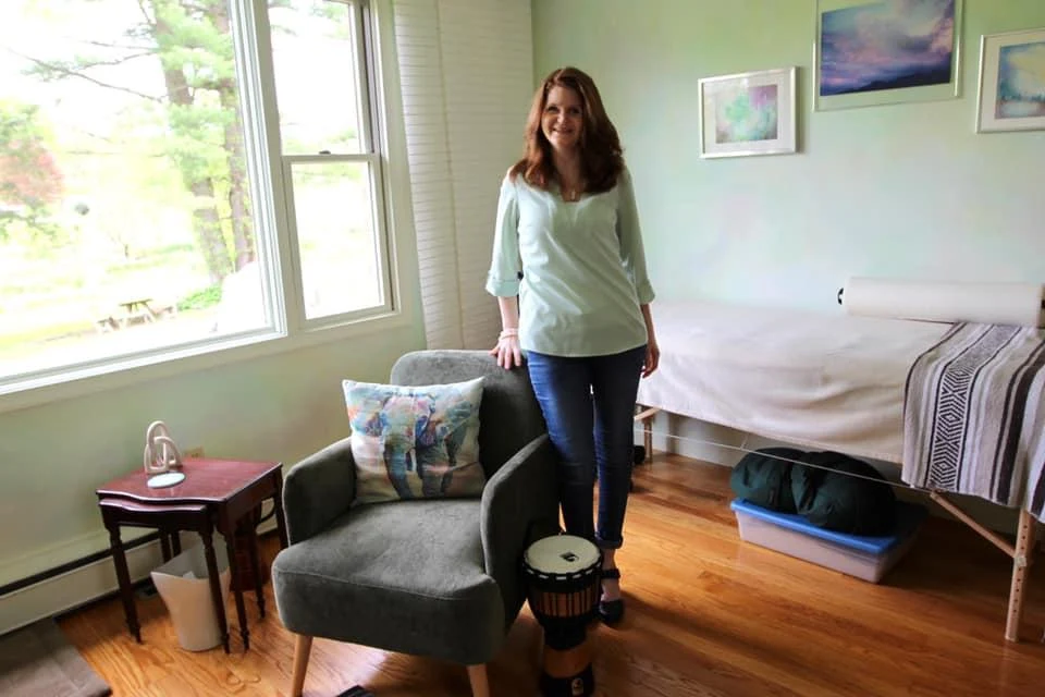 Jenna Galligani at Holistic Awakenings, standing in the treatment room