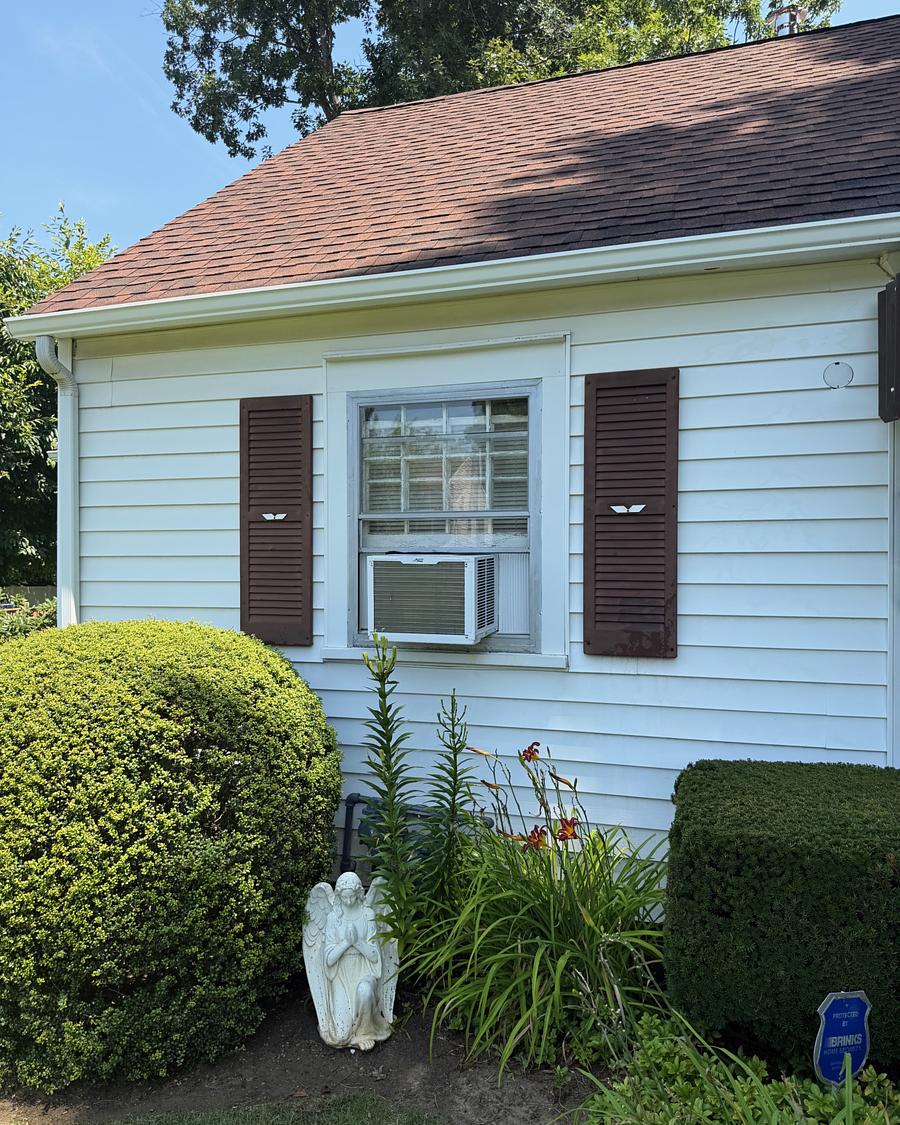 Side elevation of a white Havertown, PA cape after washing, siding uniform and free of algae