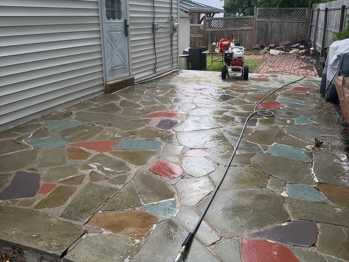 The same Havertown, PA flagstone patio after washing, the red, teal, slate and tan stones showing their real colors