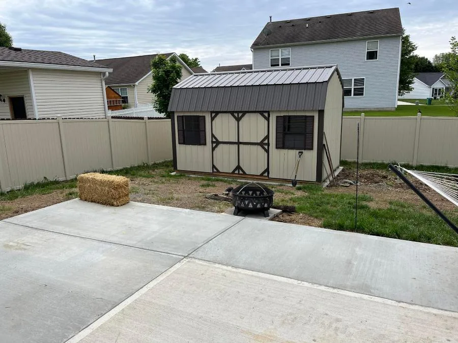 Vinyl privacy fence, concrete patio and shed