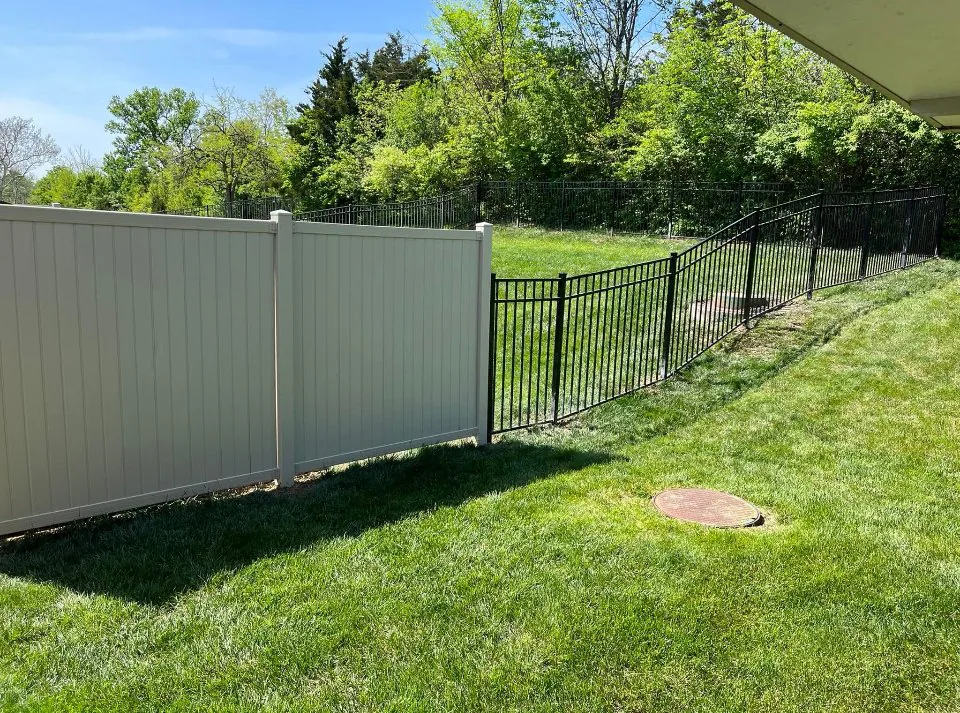 Vinyl privacy fence and aluminum run