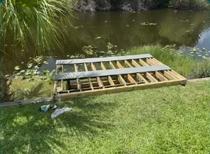 Pond dock joists over the water