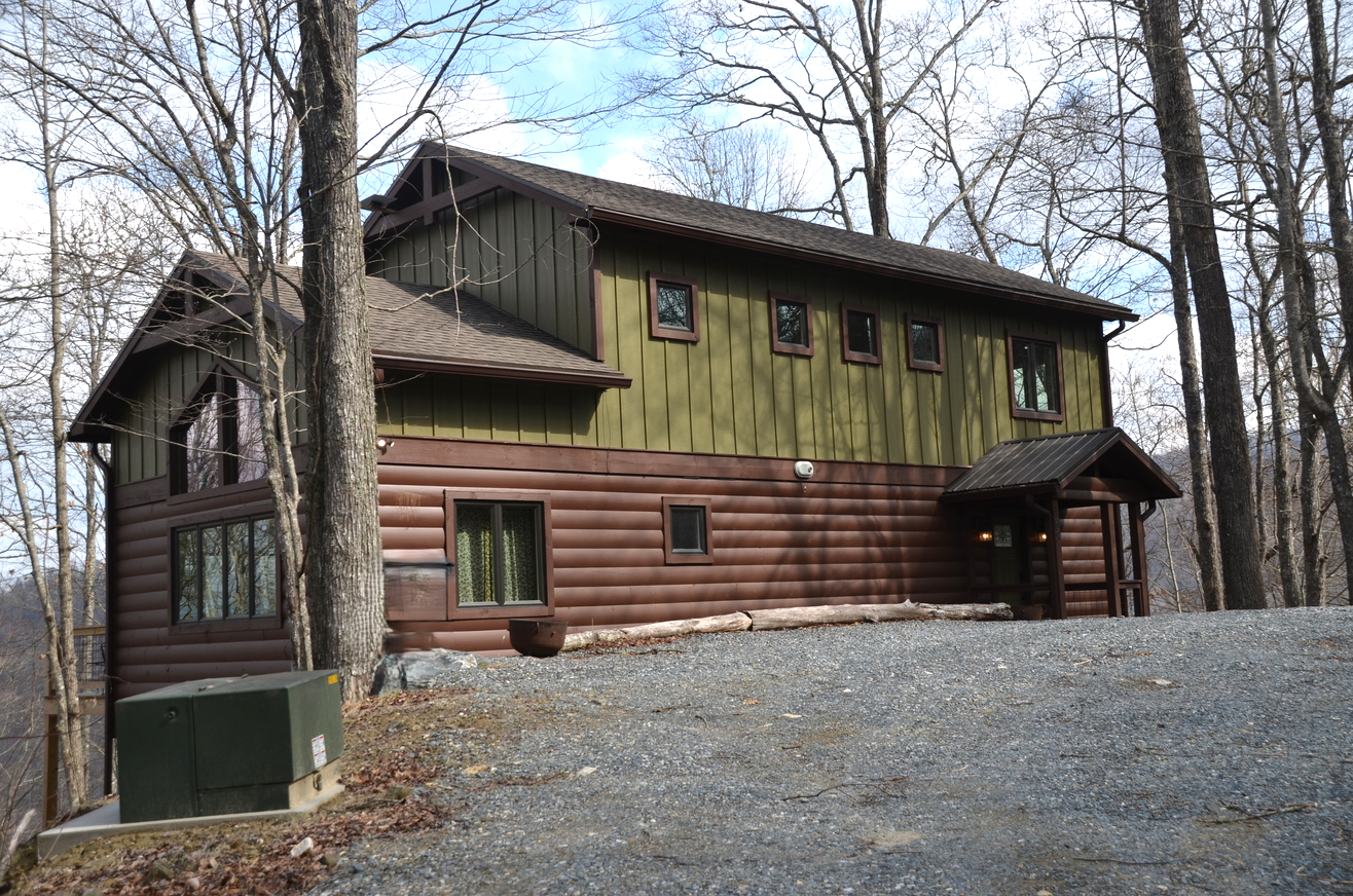 Sky Breeze mountain cabin exterior surrounded by wooded Nantahala landscape