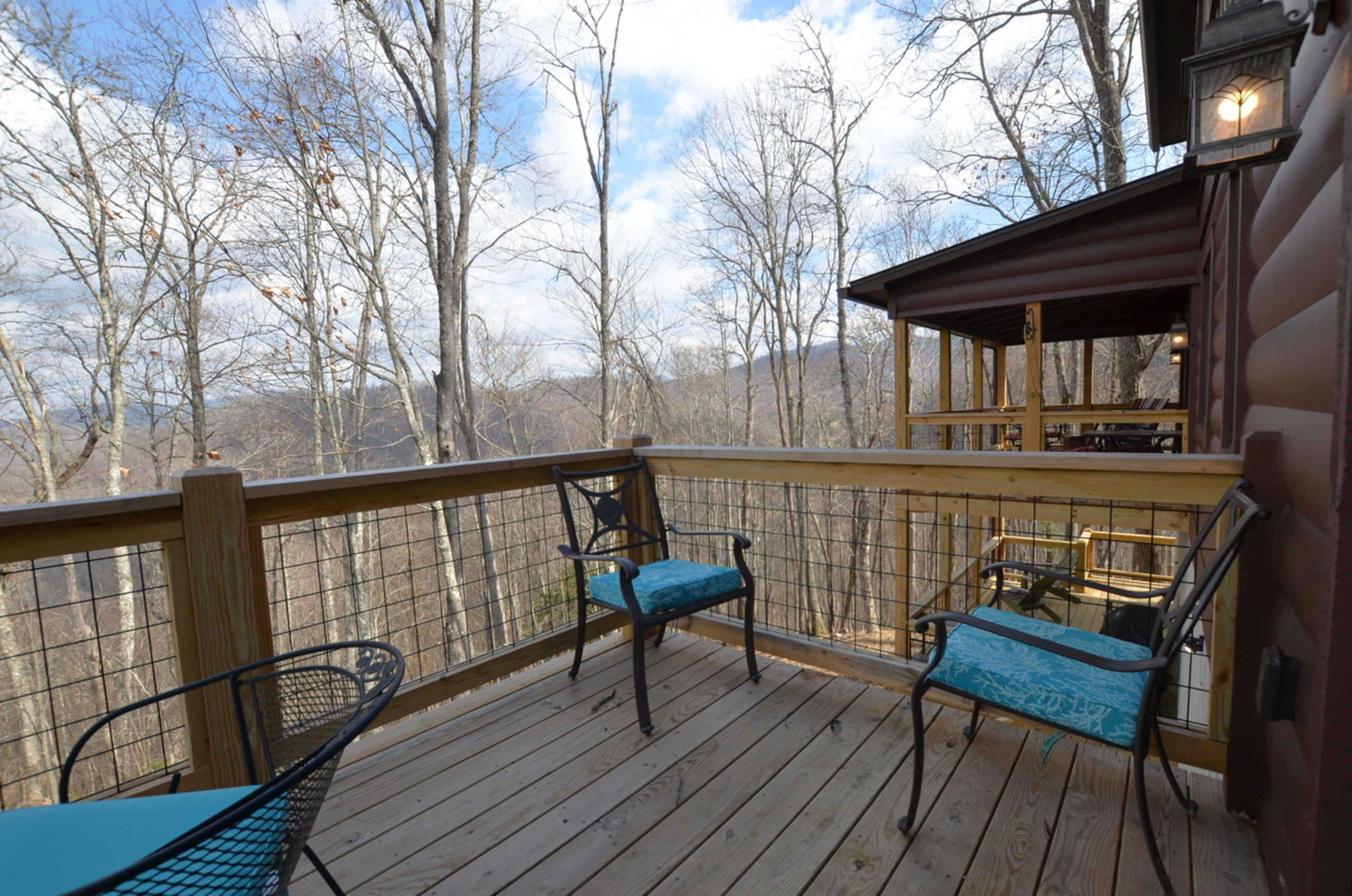 Outdoor decks at Sky Breeze cabin overlooking scenic North Carolina mountain ridges