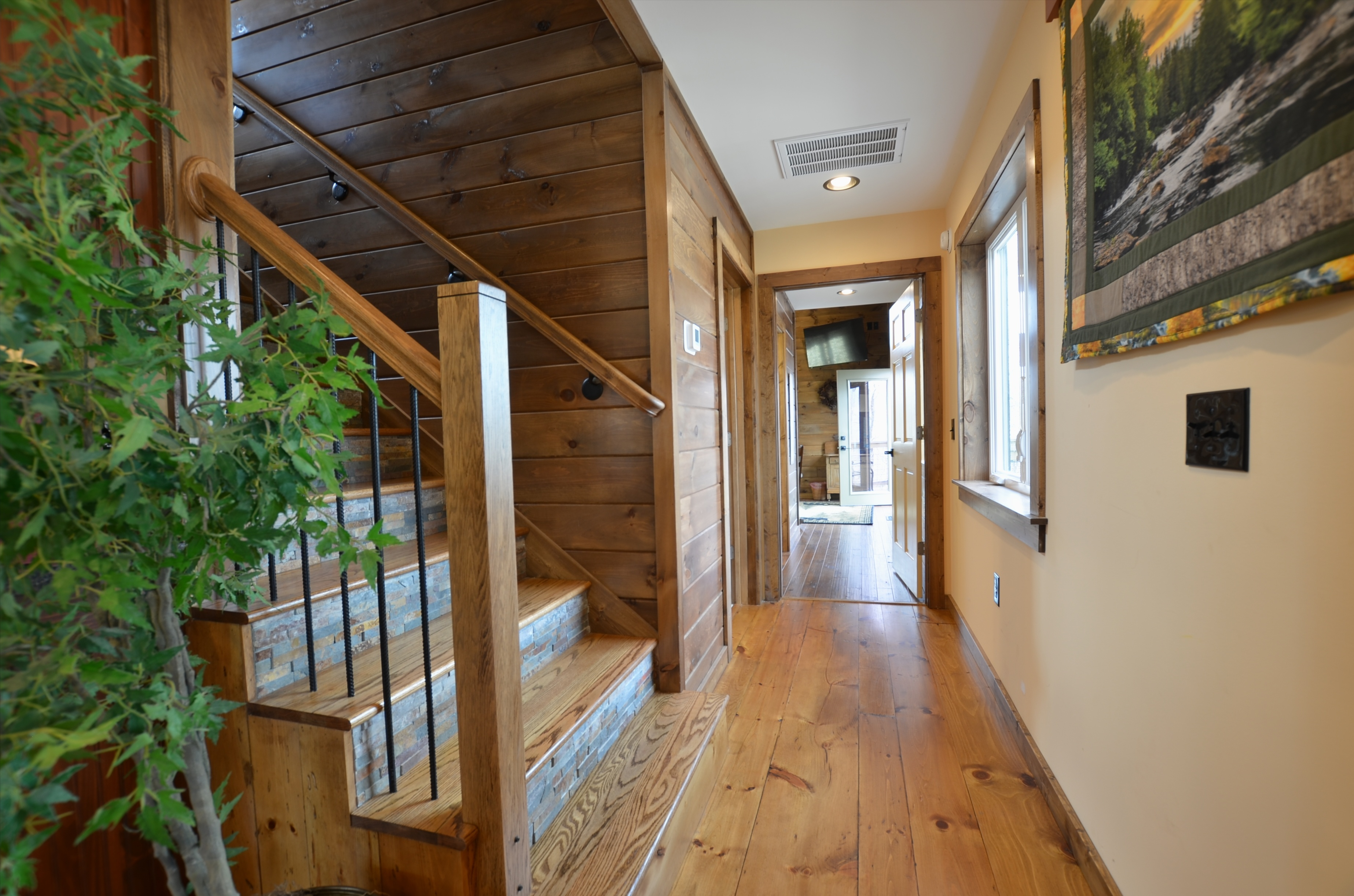 Interior hallway connecting rooms inside Sky Breeze mountain vacation rental