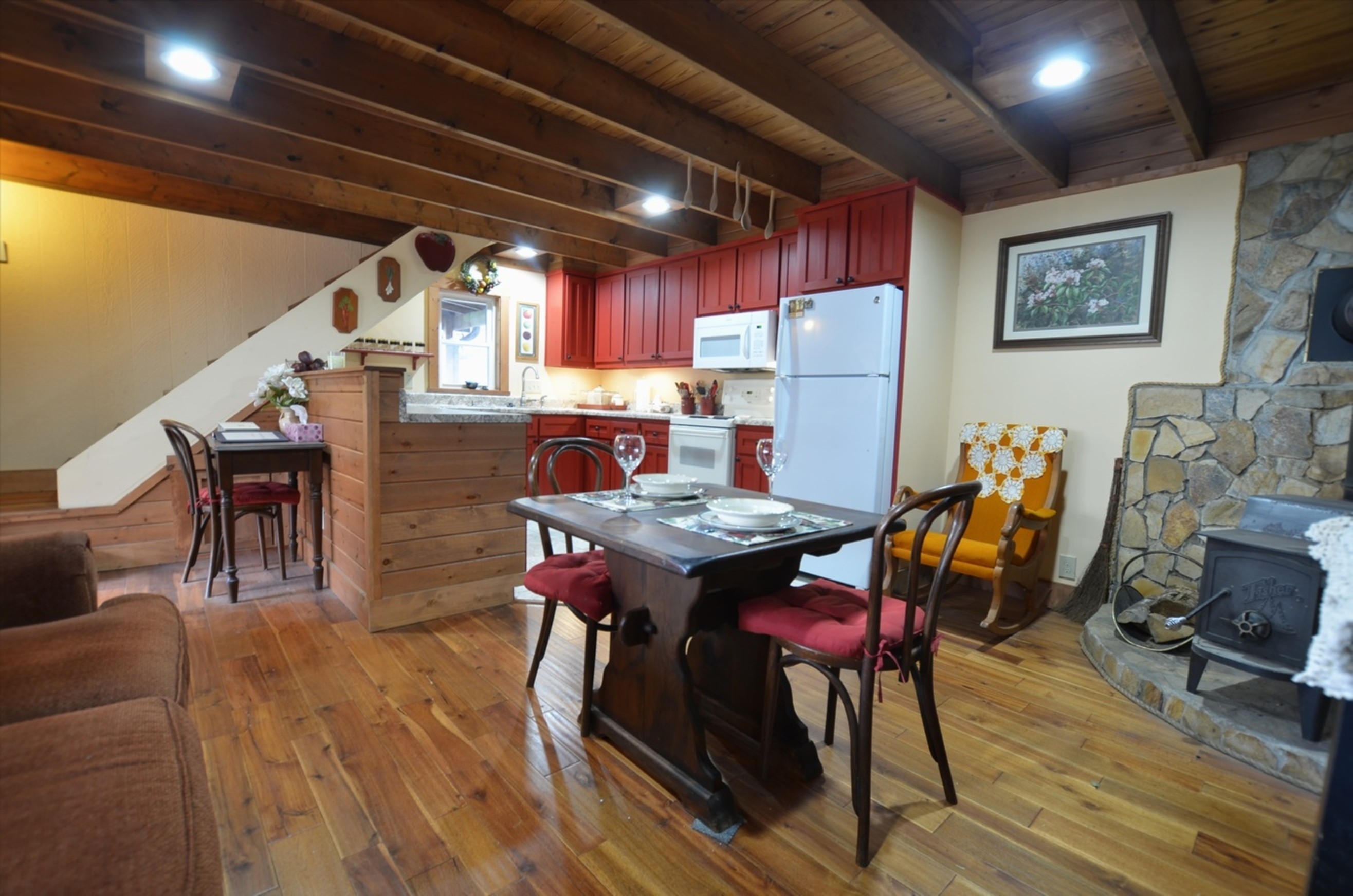 Kitchen and dining area inside Tulip Poplar one-bedroom mountain cabin