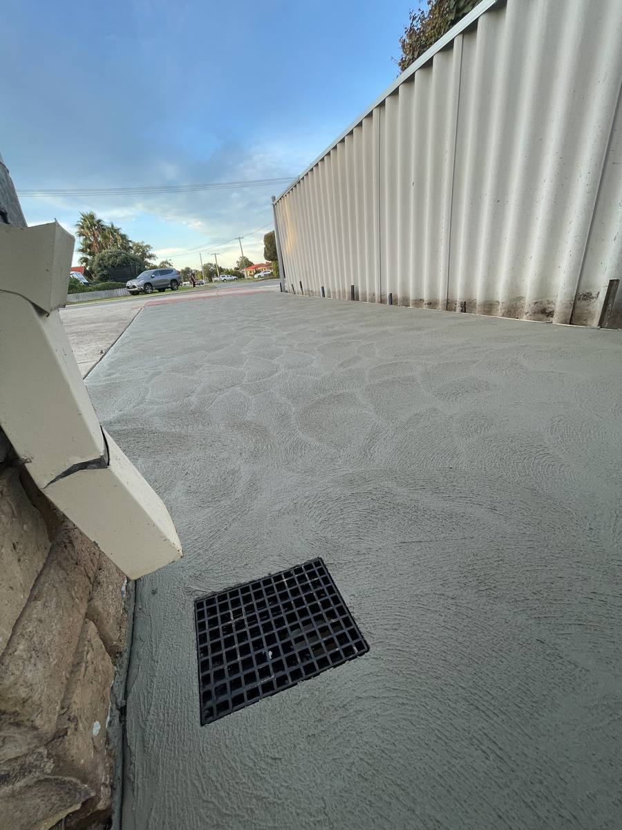 Wide concrete driveway with drainage, Perth