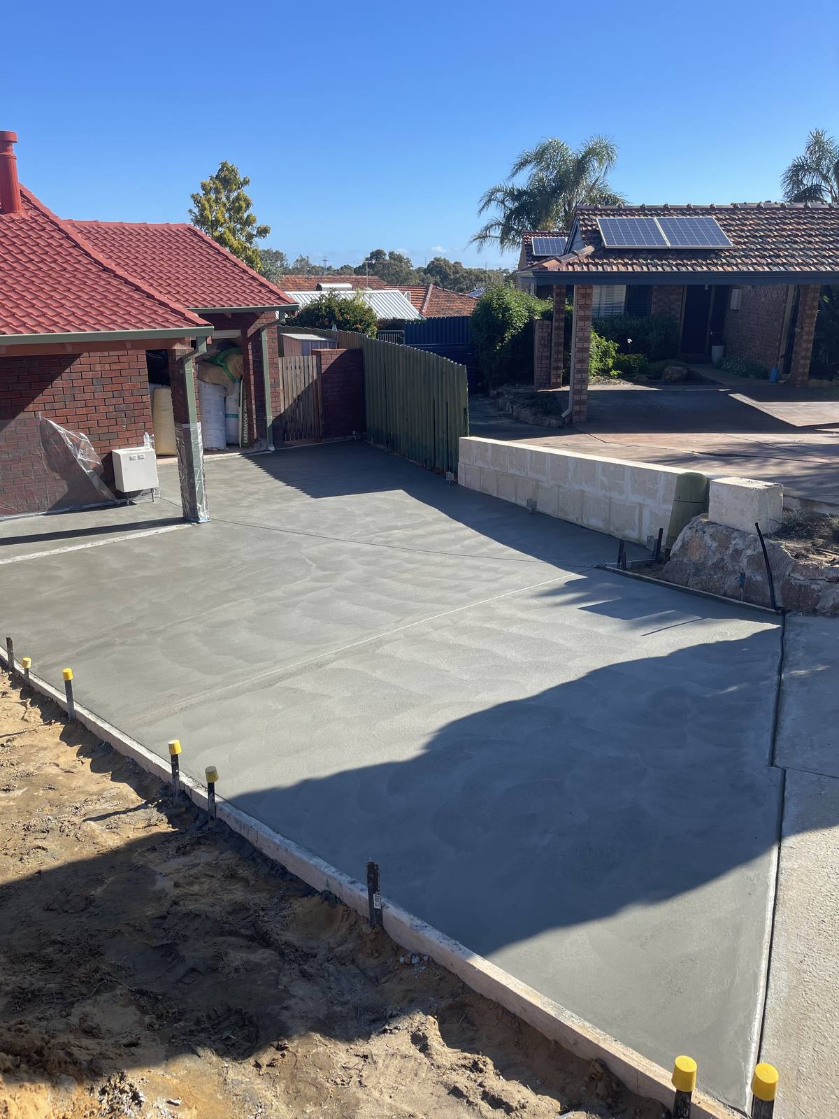 Wide reinforced concrete driveway at a Perth property