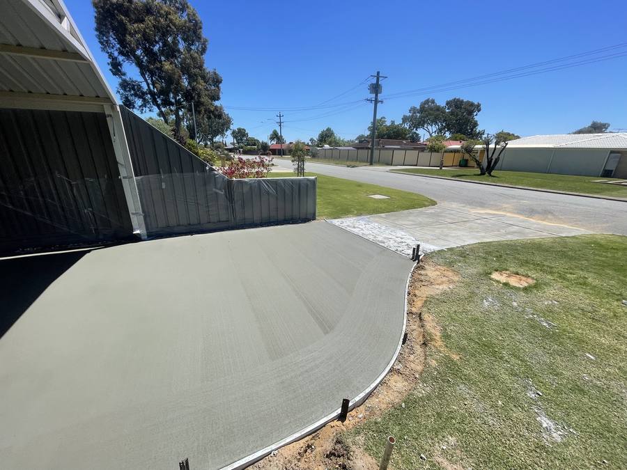 Curved concrete driveway edge with lawn