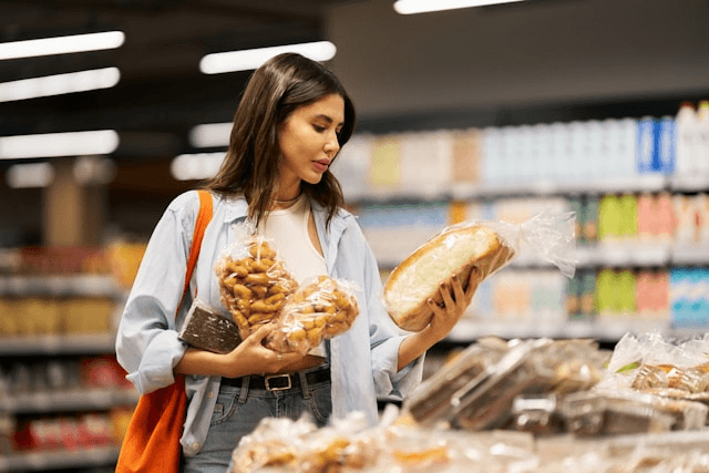 Person reading nutrition label — navigating food choices with MS.