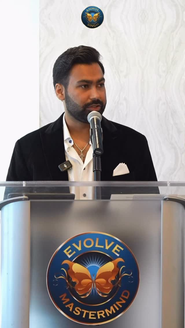 Anmol Singh speaking on stage at the Evolve Mastermind