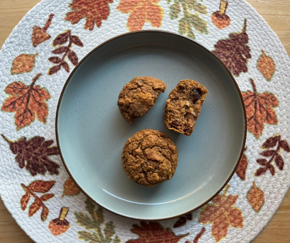 Pumpkin Banana Oat Muffins, with one muffin cut open to show the inside Pumpkin Banana Oat Muffins, with one muffin cut open to show the inside