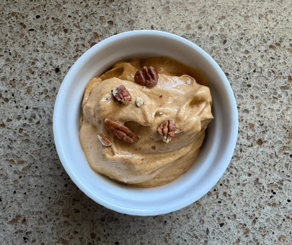 Creamy Pumpkin Pecan Nice Cream in a white bowl, topped with chopped pecans Creamy Pumpkin Pecan Nice Cream in a white bowl, topped with chopped pecans