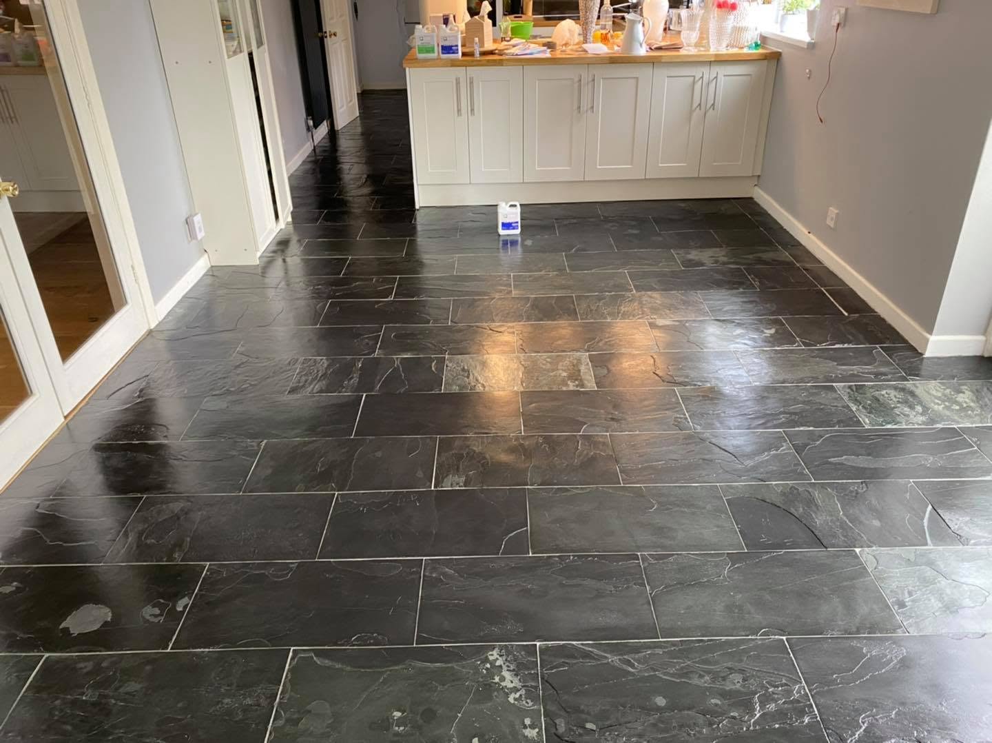 Close inspection of a natural stone floor to identify the material