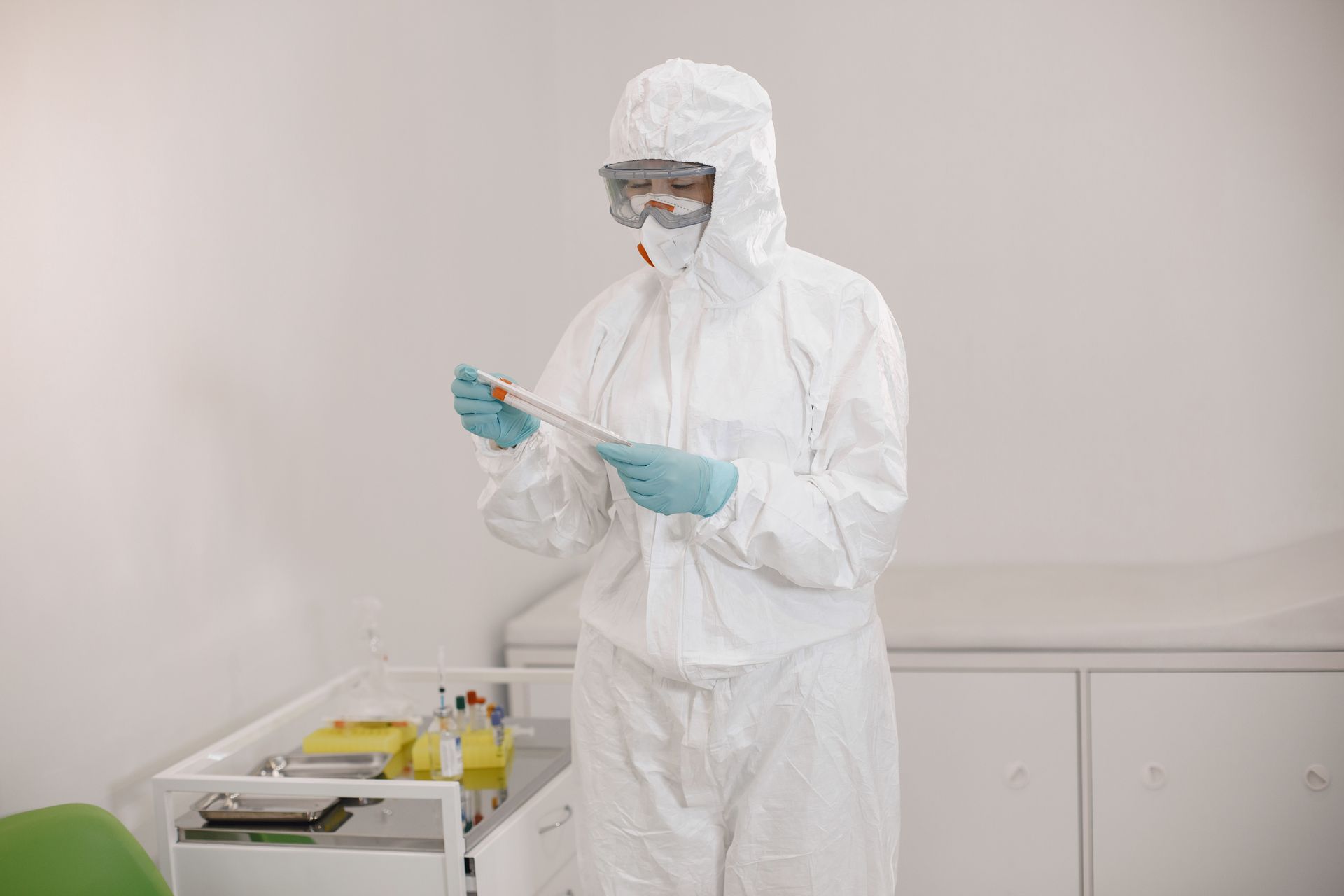 Environmental professional inspecting a laboratory sample
