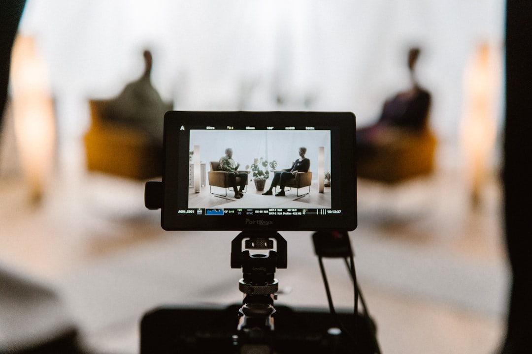 Camera operator recording an expert explanation for a business video