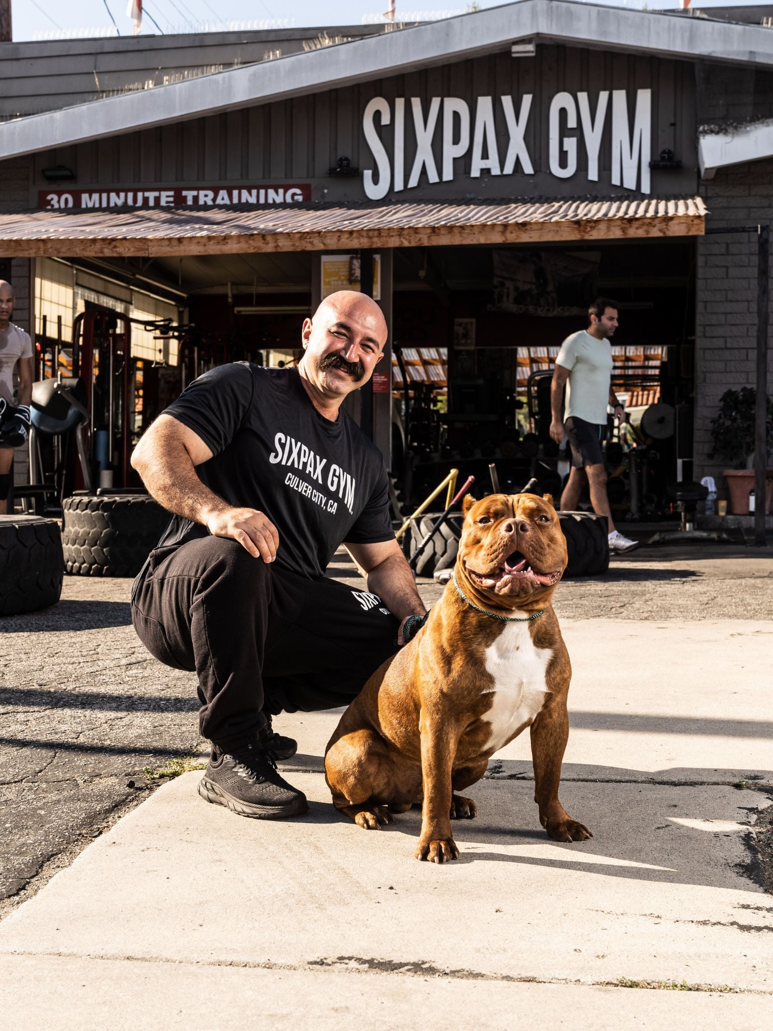 Siavash Fashi with his dog Milo outside SixPax Gym