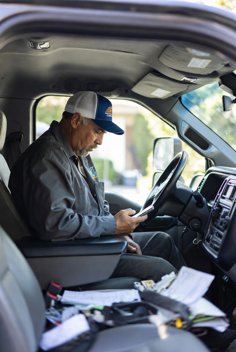 Image of Contractor sitting in his truck using ChatGPT like a Google Search