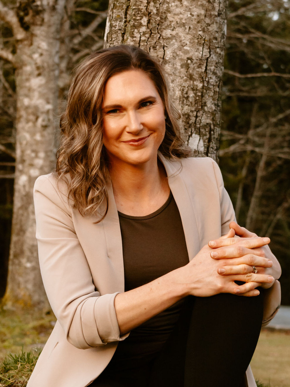 Linda bartholme sitting mindfully in nature, providing mental fitness coaching