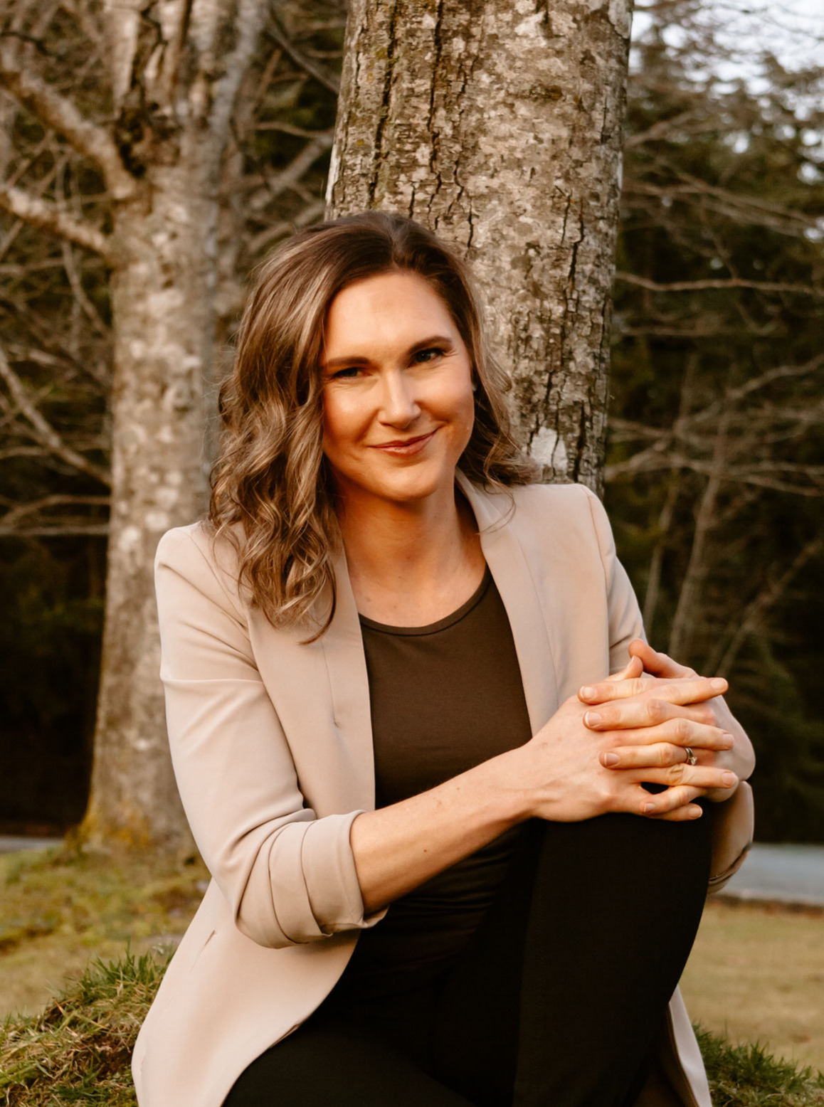 Linda bartholme sitting mindfully in nature, providing mental fitness coaching