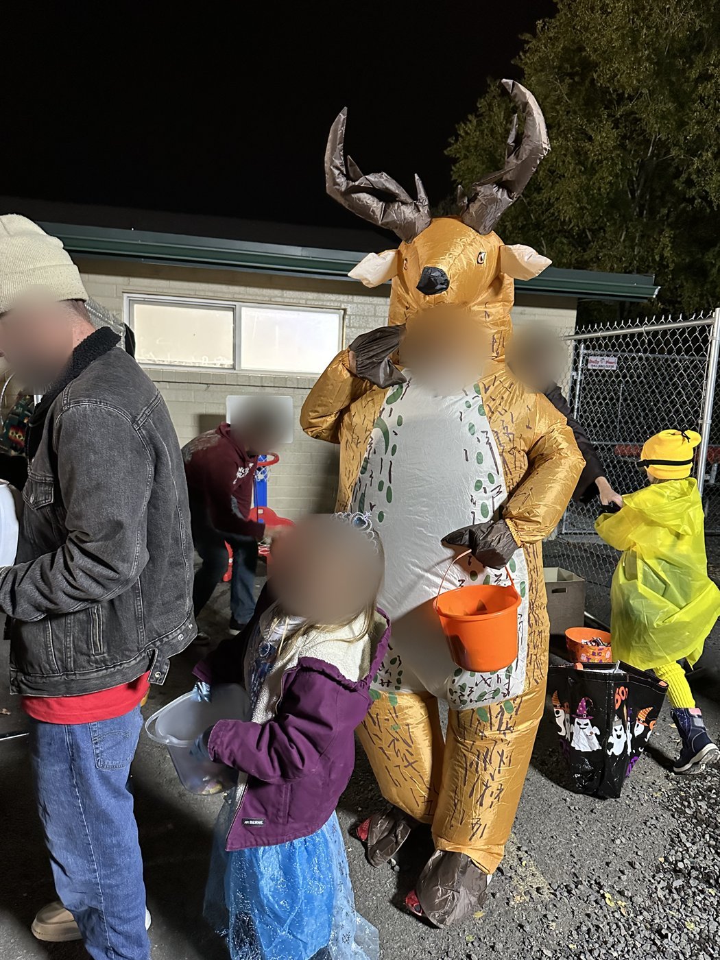 Elsa and an inflatable reindeer trick-or-treating at night