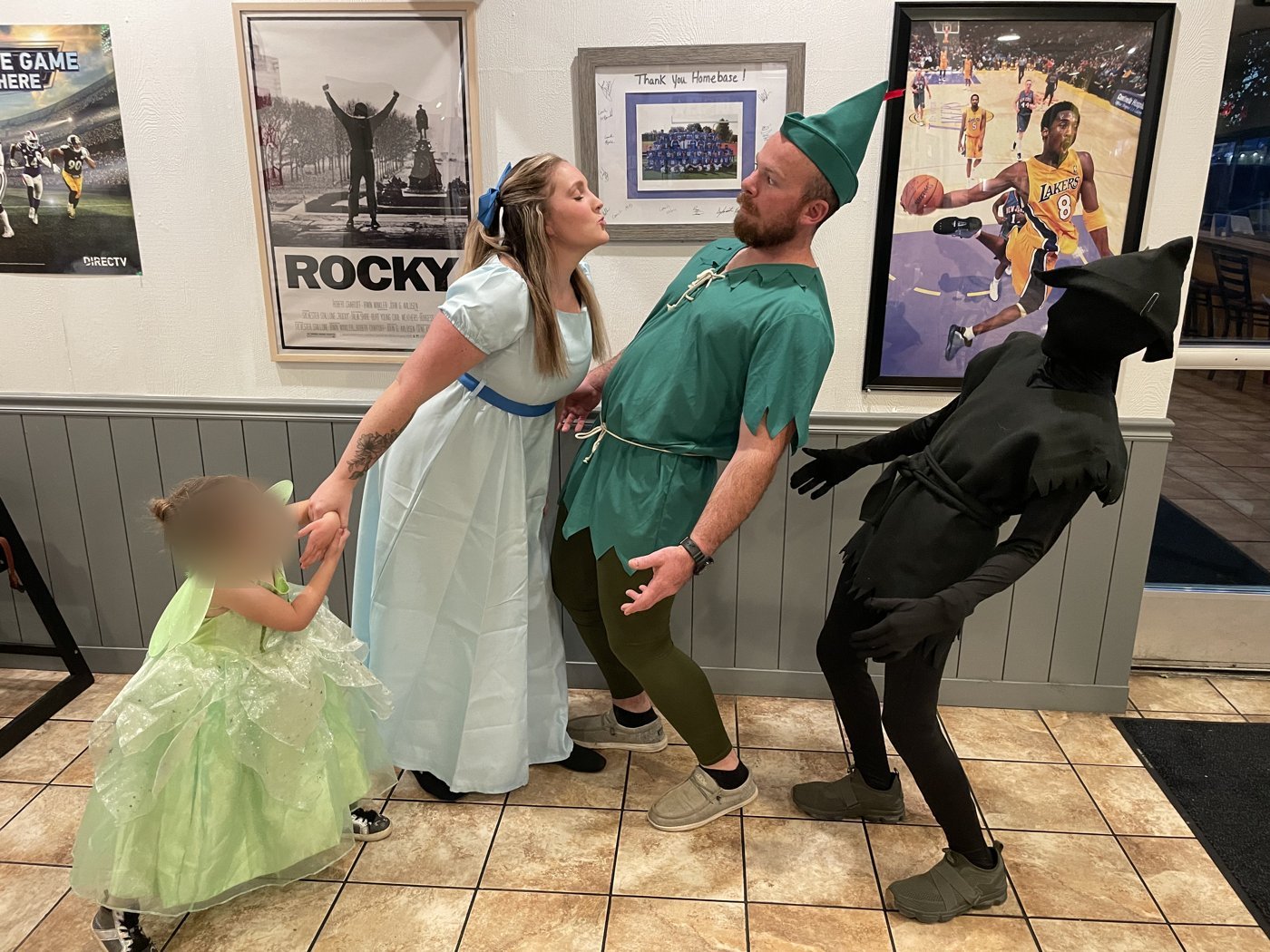 Family dressed as Wendy, Peter Pan, Tinker Bell and the Shadow