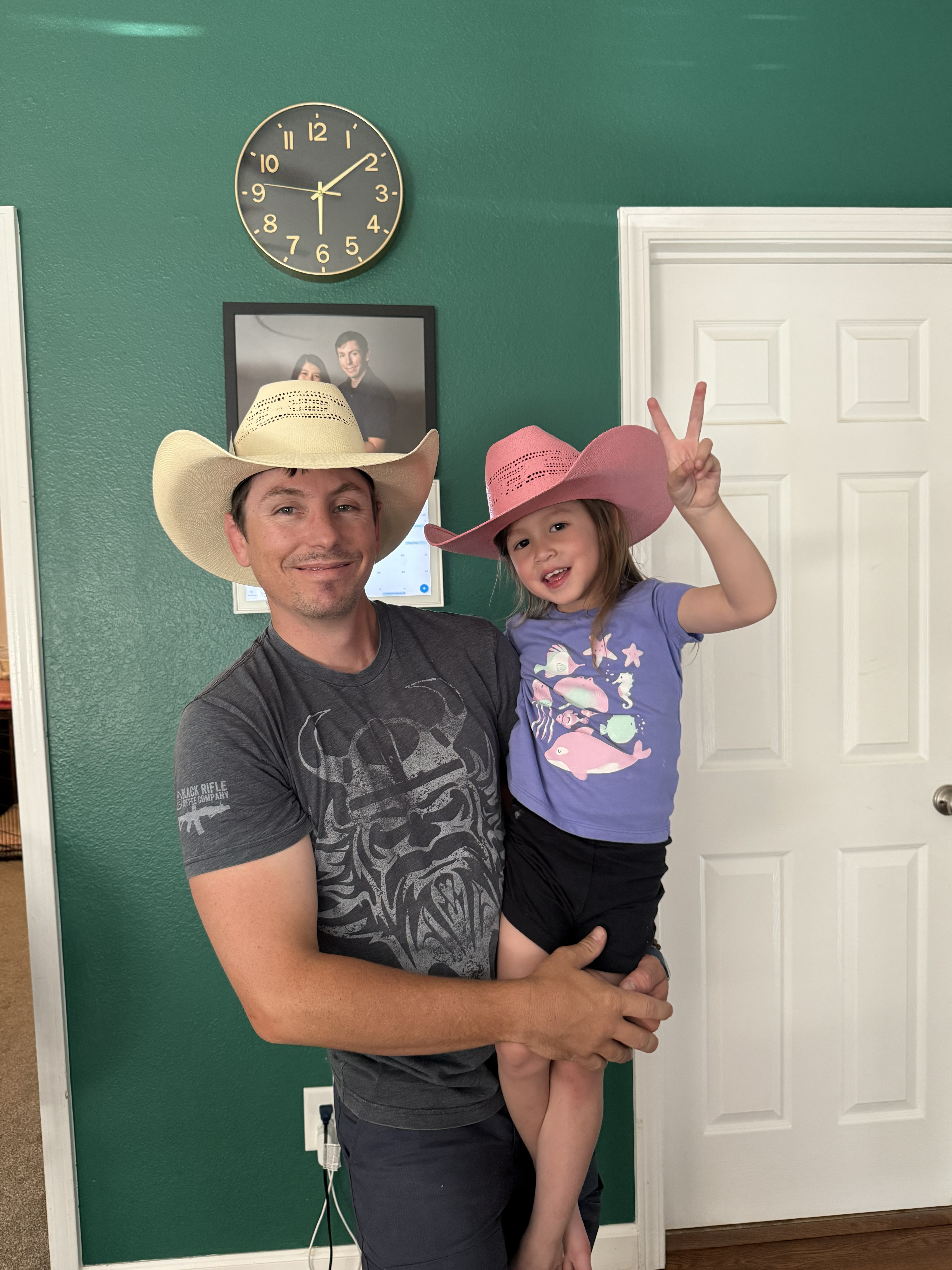 Dad and his buckaroo wearing matching custom hats