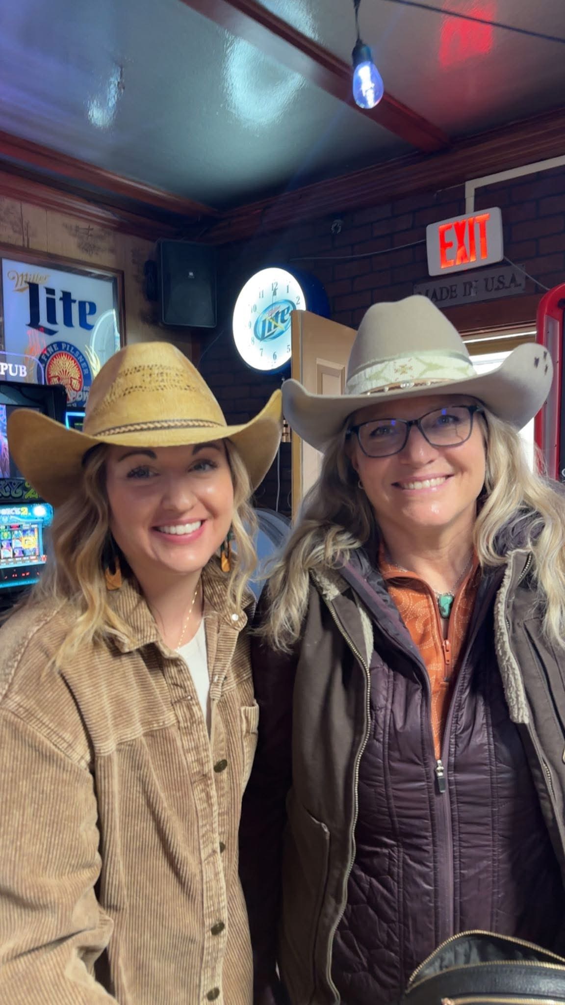 Two women wearing their hats