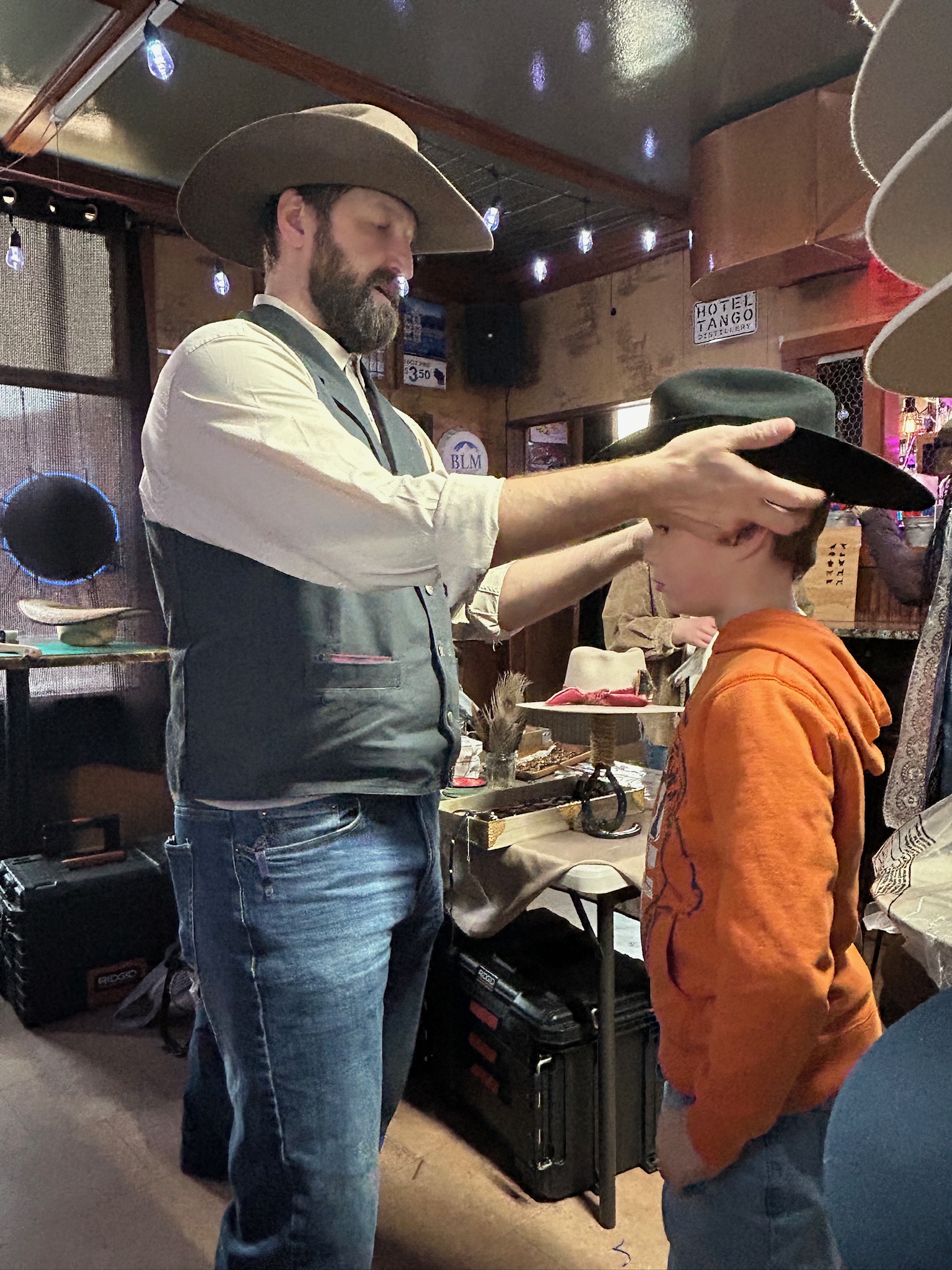 Sizing and shaping a hat at a hat bar