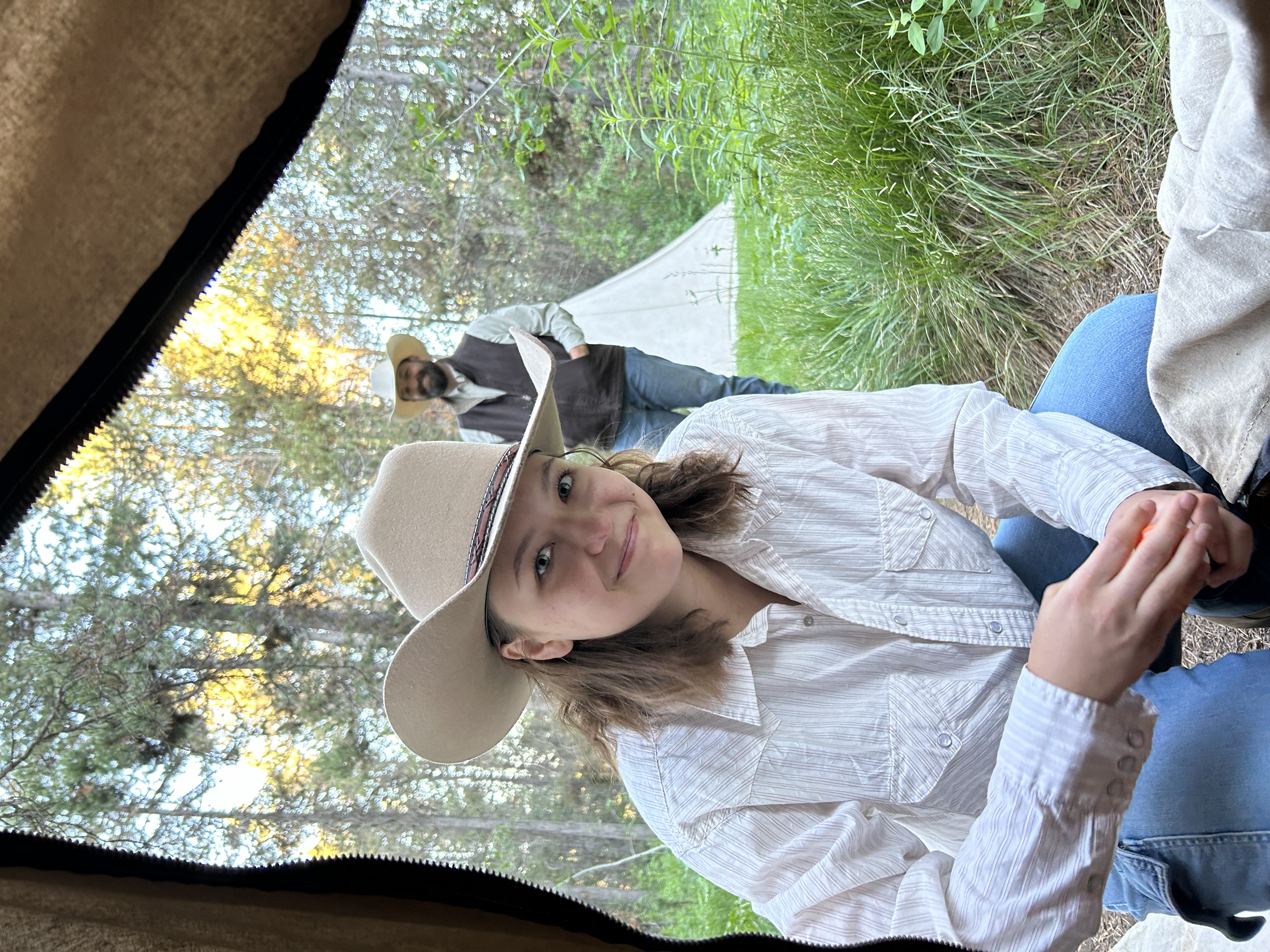 The owner of Hangman Hats and his youngest daughter at their campsite during the Teton Mountains trip