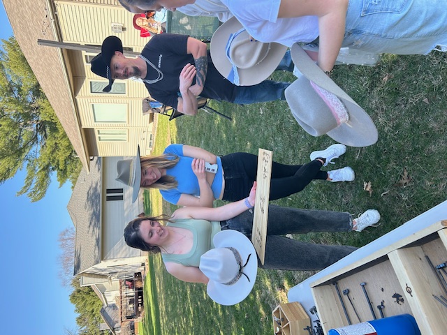 Guests choosing how to design their hats at a hat bar