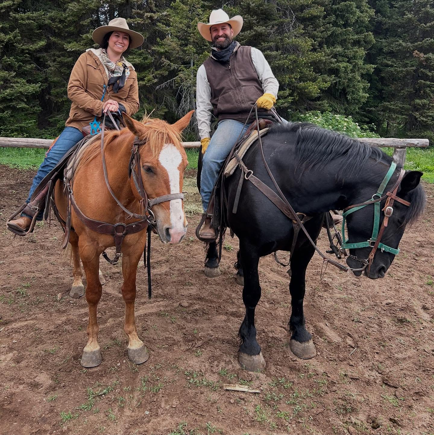 Jen and the owner of Hangman Hats riding horseback during their trail ride in the Teton Mountains