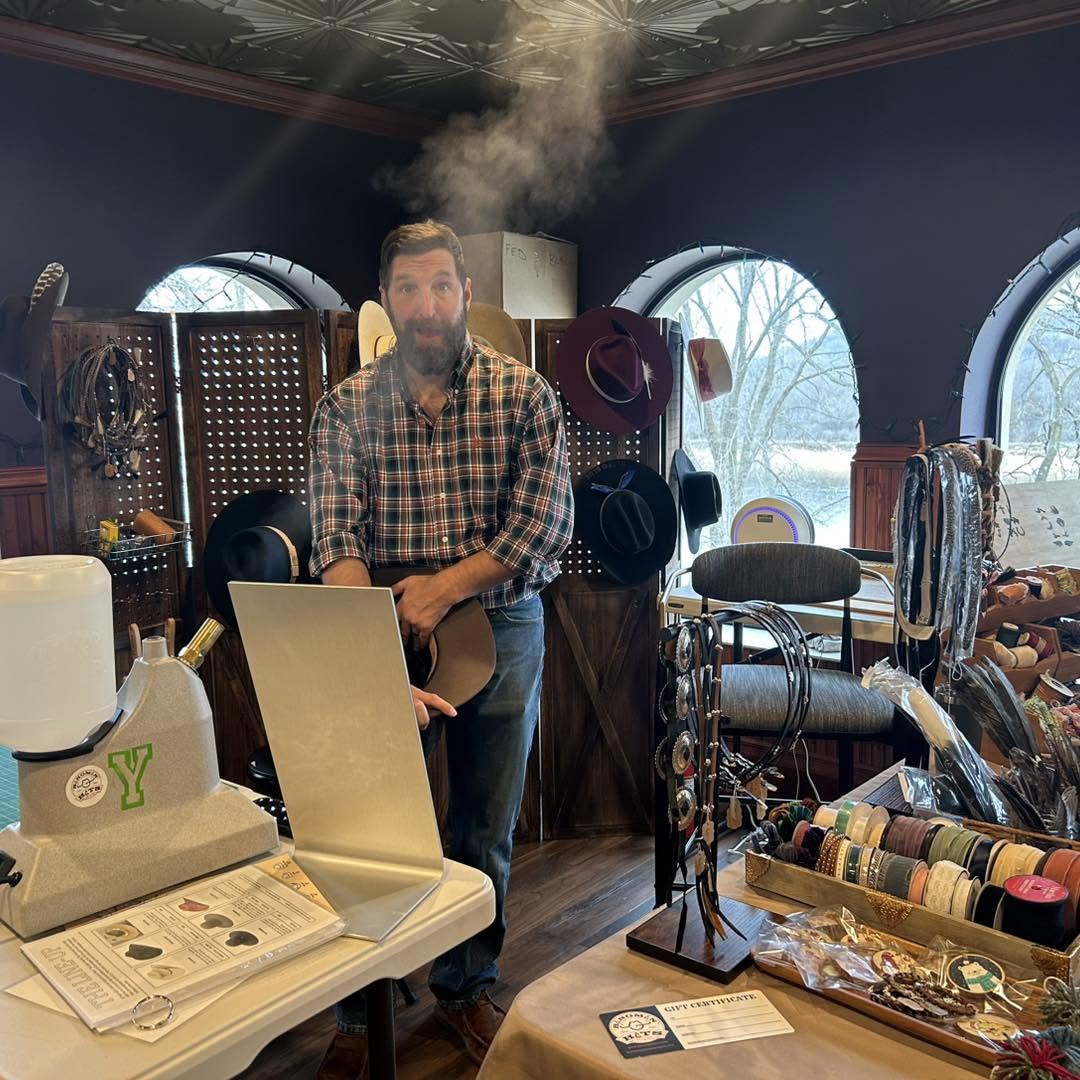 The owner of Hangman Hats steaming a hat at one of the company's first events
