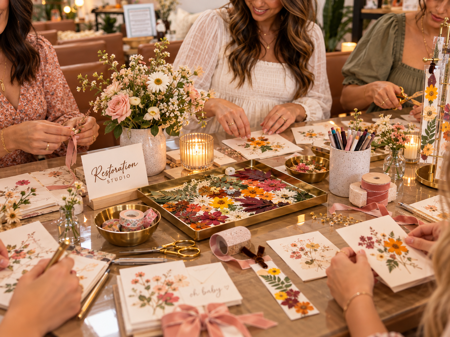 Guests painting watercolor cards and stitching botanical embroidery