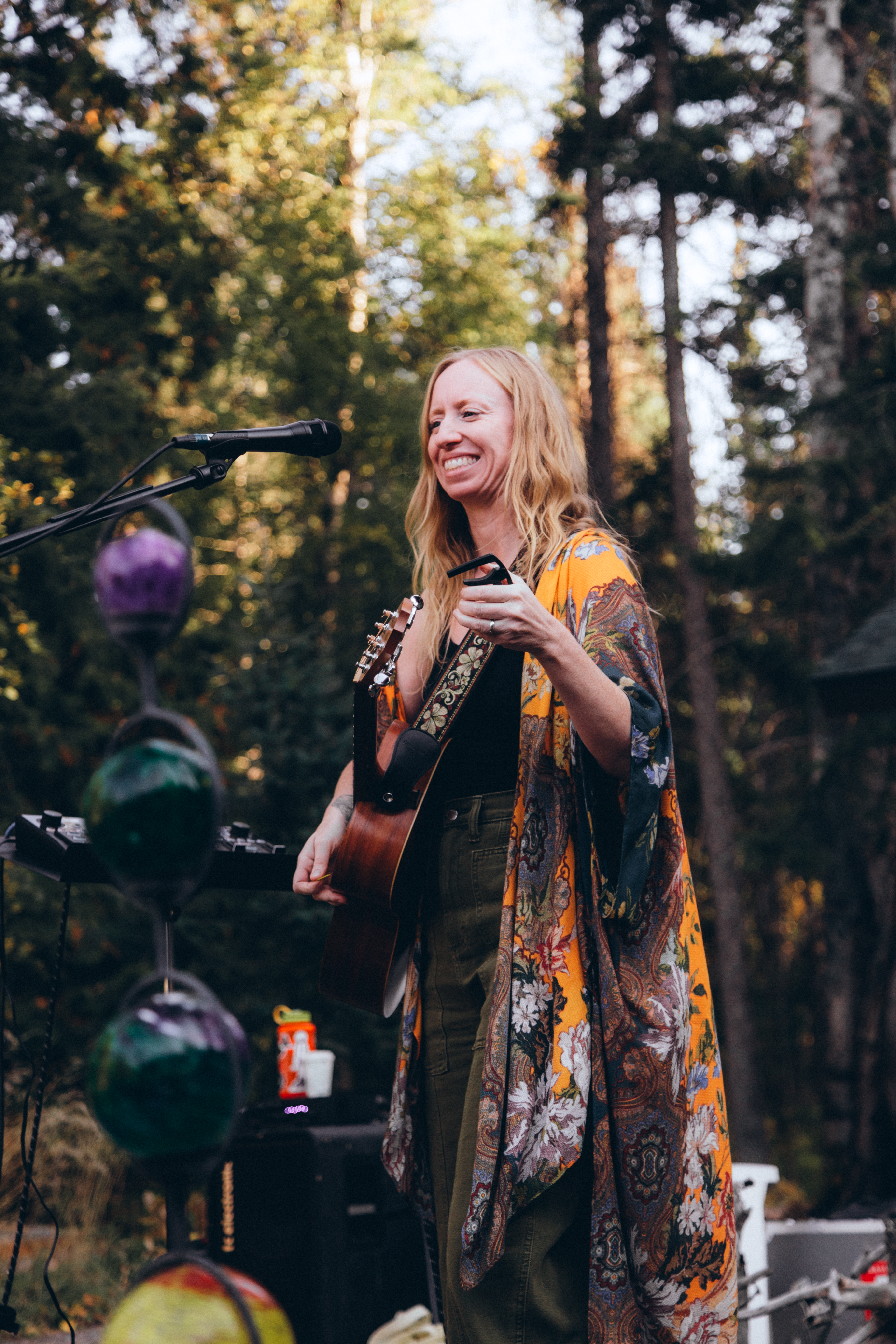 Jamie Wyman on an outdoor stage singing