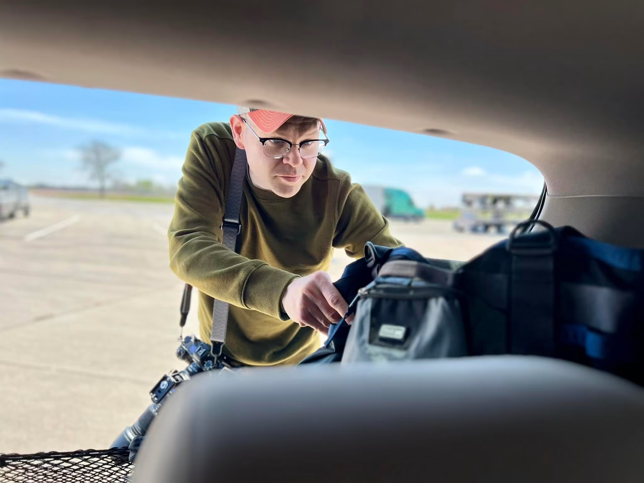 Justin pulls his camera equipment to prepare. Justin pulls his camera equipment to prepare.