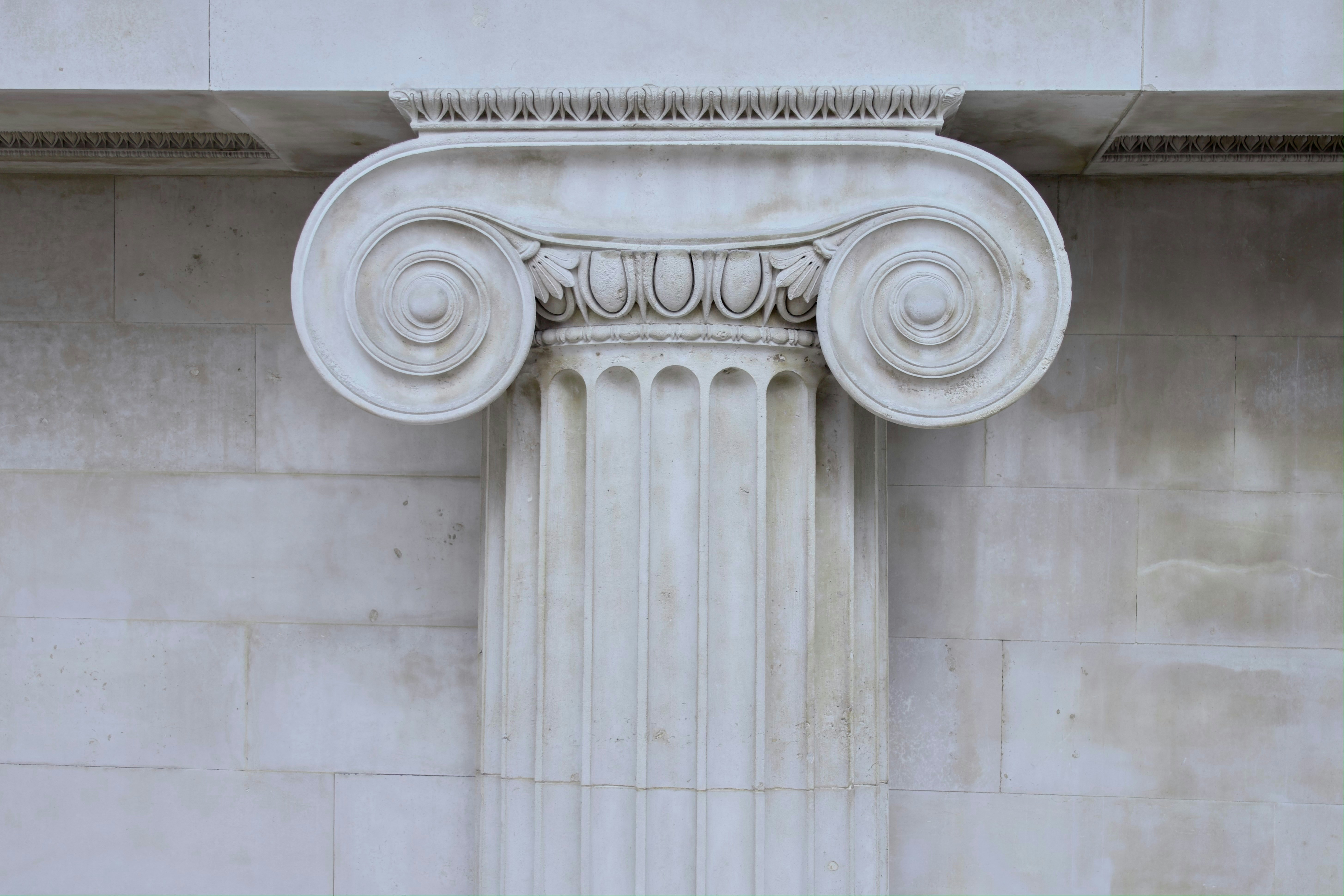 A photo of the top of an ionic column