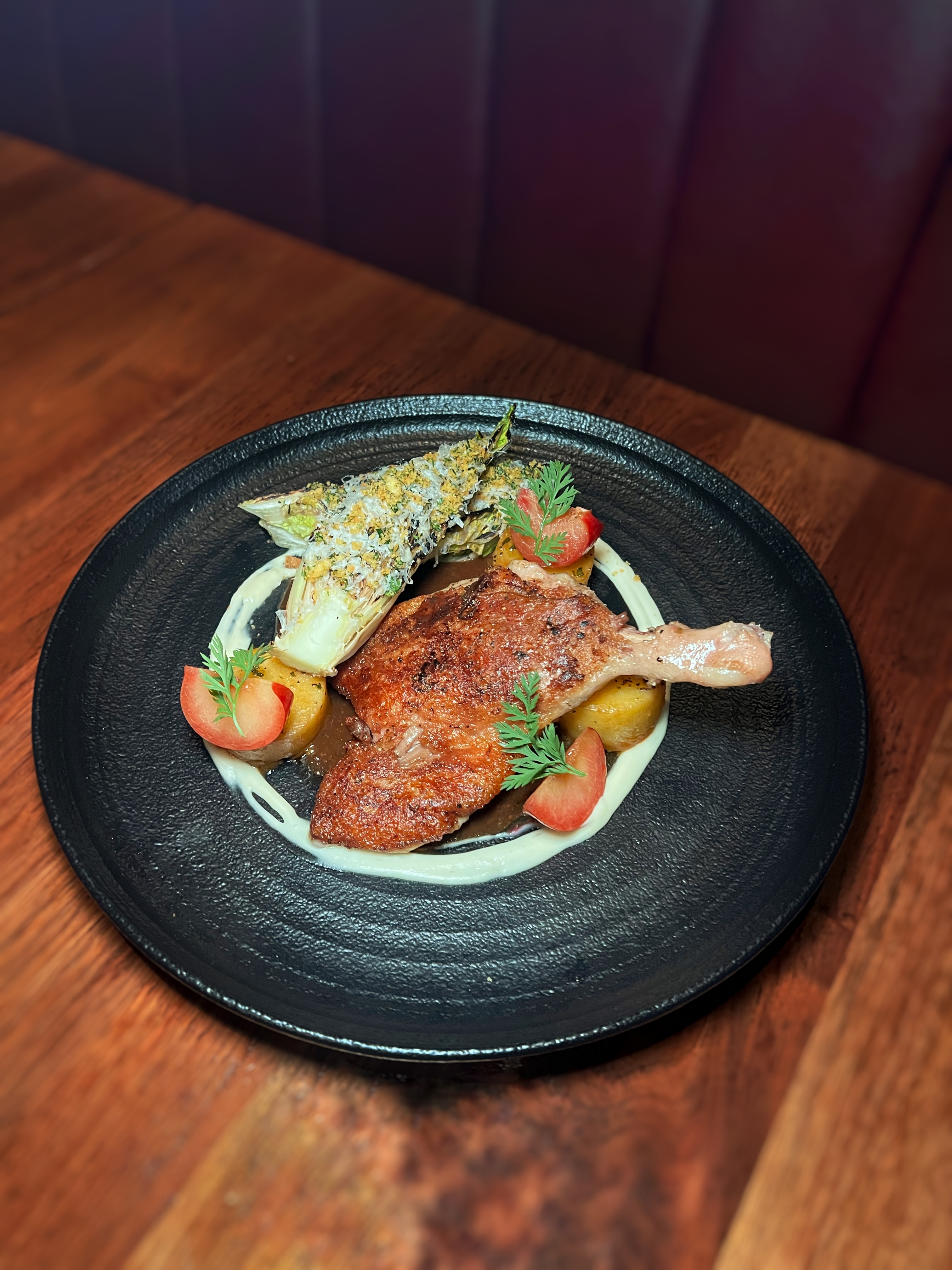 Roasted Duck Leg with Caramelized Vegetables at Et Voilà French Bistro