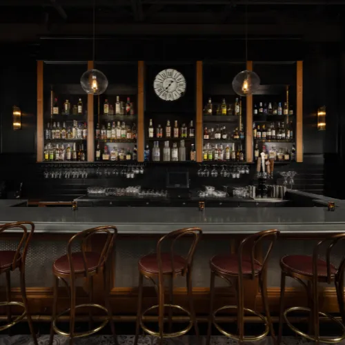 The Zinc Bar & Wall Clock at Et Voilà French Bistro
