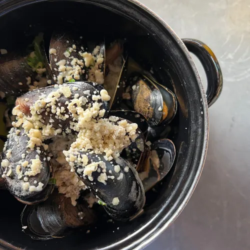 Steamed Mussels in Garlic Broth at Et Voilà French Bistro