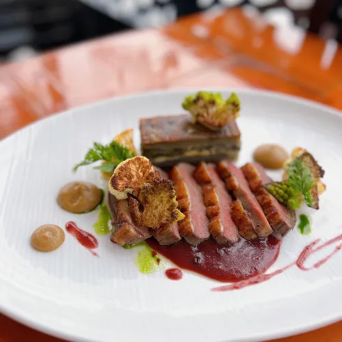 Seared Meat with Garnish at Et Voilà French Bistro