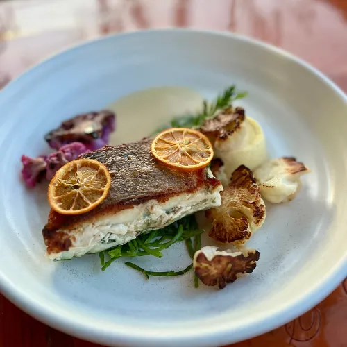 Seared Fish with Citrus & Edible Flowers at Et Voilà French Bistro