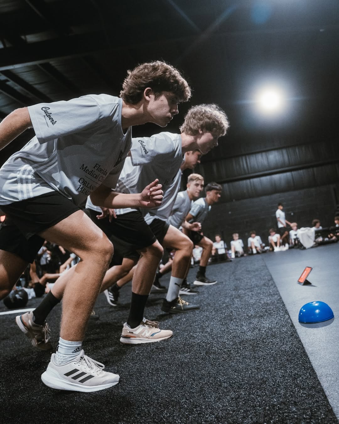 Athletes sprinting from stance at YMP Tampa