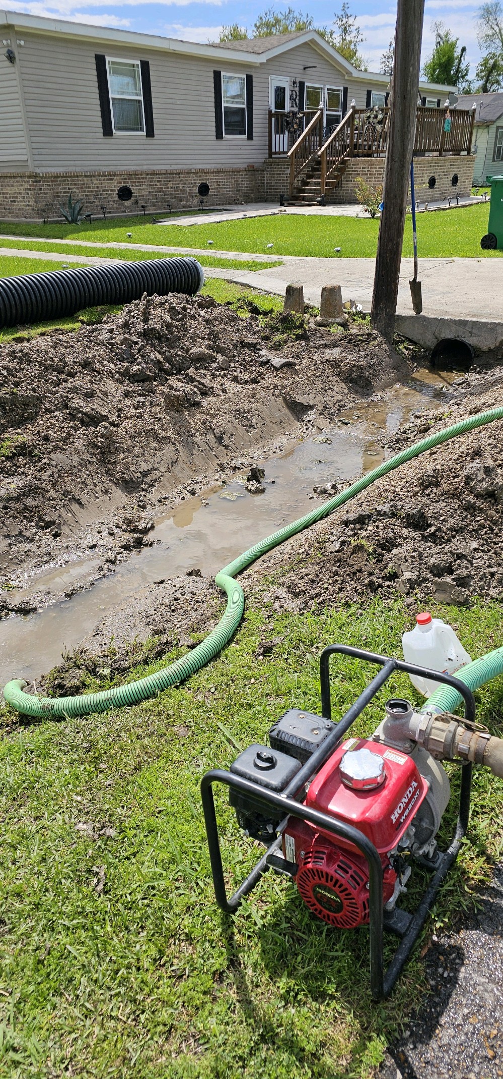 Drainage work, excavation, and parish equipment in progress