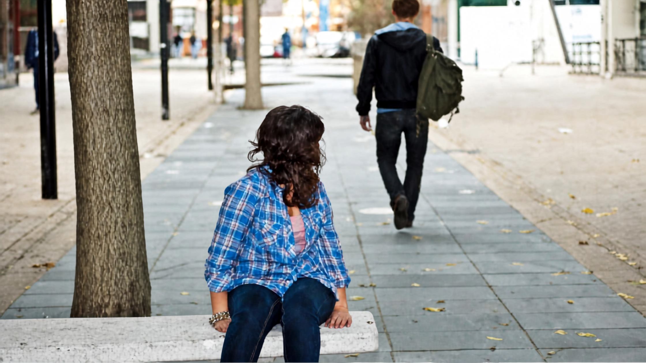 Person sitting alone on bench watching someone walk away, representing the emotional pain of leaving a narcissist, difficulty of no contact, and the hard decision to walk away from abuse Person sitting alone on bench watching someone walk away, representing the emotional pain of leaving a narcissist, difficulty of no contact, and the hard decision to walk away from abuse